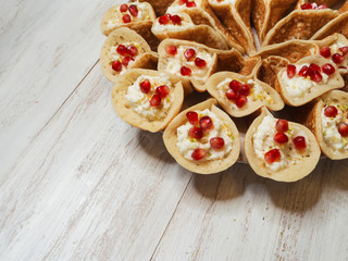 Pomegranate Qatayef Asafiri, Arabian pancake stuffed with sweet cheese.
