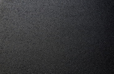 Fototapeta na wymiar Texture black rough surface small convexity background