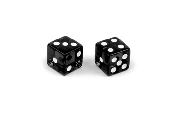 Two black glass dice isolated on white background. Three and four.