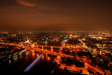 Fototapeta na wymiar City Scape, Panorama of Chao Praya River. River view overlooking the Phra Phuttha Yodfa Bridge, Memorial Bridge and Wat Arun with grand Palace in the background, Bangkok Thailand. 26 January 2019