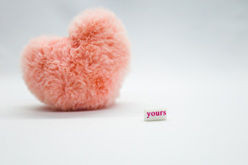 Pink heart on the white background