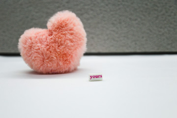 Pink heart on the gray background