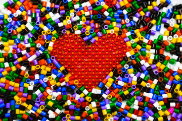 Red heart of red constructor on a constructor background