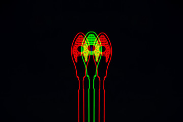 Neon silhouettes of street lamps on a black background. Glitch effect.