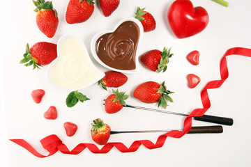 Valentine Chocolate fondue melted with fresh strawberries and dark and white chocolate. Tublips and sugar hearts.