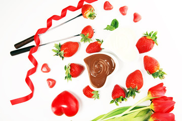 Valentine Chocolate fondue melted with fresh strawberries and dark and white chocolate. Tublips and sugar hearts.