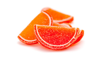 Citrus jelly slices in sugar on white background