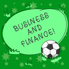 Writing note showing Business And Finance. Business photo showcasing Management of assets and money of an organization Soccer Ball on the Grass and Blank Outlined Round Color Shape photo
