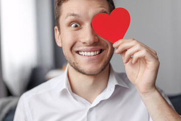 Funny male with heart hear eye