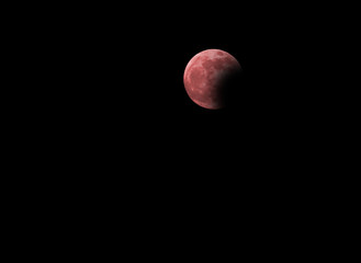 lunar eclipse with the big red full moon in the dark night