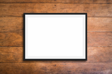 empty black frame on wooden background - picture mockup  -