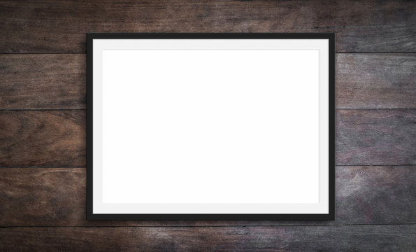 black frame on wooden background - blank  picture mockup