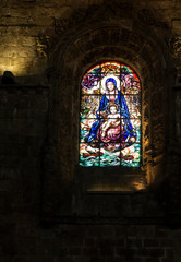 Lisbon, Portugal, June 16, 2018: Colorful stained glass. Detail of the inside of the Jeronimos...