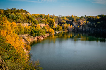 Old flooded quarry in autumn