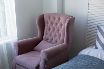 furniture. pink chair. soft chair by the bed