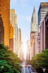 Poster 42nd street, Manhattan viewed from Tudor City Overpass with Chrysler Building in background in New York City during sunny summer daytime at sunset © Stefan
