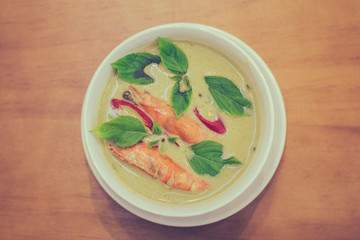 thai Green Curry with Prawns in a white porcelain bowl