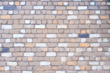 lightened brick wall, bricks of different color and tone