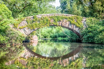 Wall murals Gapstow Bridge Beautiful Gapstow bridge reflecting in water in Central Park, New York City during summer sunny day