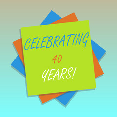 Handwriting text Celebrating 40 Years. Concept meaning Honoring Ruby Jubilee Commemorating a special day Multiple Layer of Blank Sheets Color Paper Cardboard photo with Shadow