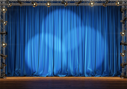 Empty theater stage with blue velvet curtains and spotlights. 