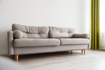 Grey sofa in monochromatic living room
