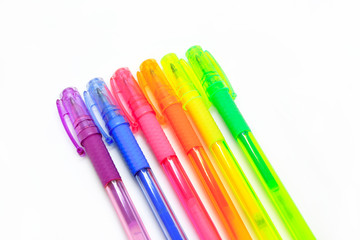 Colorful gel pens isolated on white background