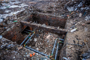 Opened for repairing heating main with water pipeline