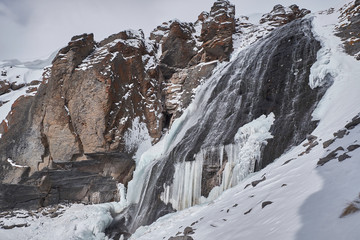 Fototapeta na wymiar Waterfall Girlish Braids. Elbrus region