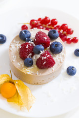 Food. Souffle, raspberries, blueberries, physalis