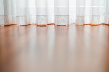 Low angle view of the brightly lit curtain  by the window