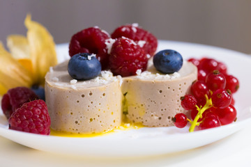 Food. Souffle, raspberries, blueberries, physalis