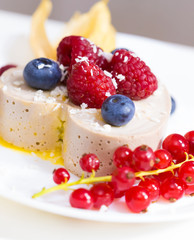 Food. Souffle, raspberries, blueberries, physalis