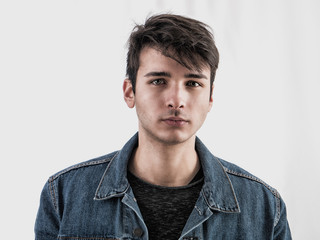 Fototapeta premium Close-up of handsome young man or teenager in studio