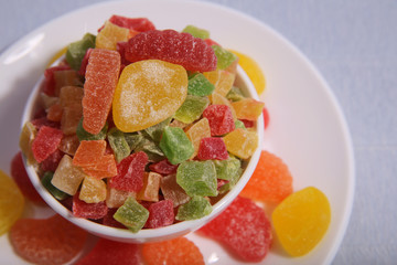 Plates with sweets. Marmalade and candied fruit.