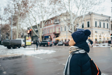 Young woman wearing winter knitted hat