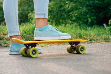 Female's foot on bright plastic skateboard © progressman