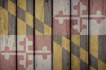 USA Politics News Concept: US State Maryland Flag Wooden Fence