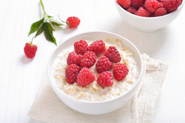 Tasty oatmeal porridge with raspberries