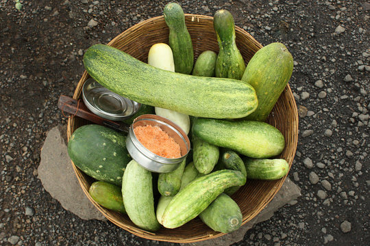 Cucumber in cane basket ready for sale on street.