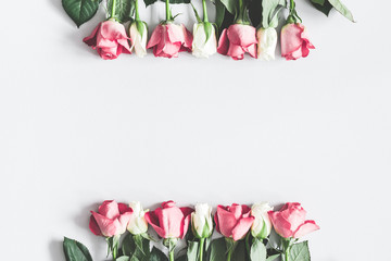 Flowers composition. Pink and white rose flowers on pastel gray background. Valentines day, mothers day, womens day concept. Flat lay, top view, copy space