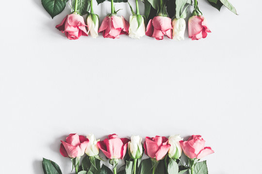 Fototapeta Flowers composition. Pink and white rose flowers on pastel gray background. Valentines day, mothers day, womens day concept. Flat lay, top view, copy space