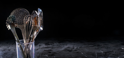 Kitchen utensils. Different spoons and other accessories. Space for text