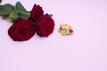 Roses on a pink background, a bouquet of red roses. Valentine's Day, Happy Mother's Day. Happy women's day. Copy cpace. Gift