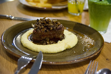 Beef fillet with mashed potato and mushrooms