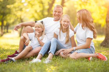 Family with children relaxing on the street, with smiles and happiness