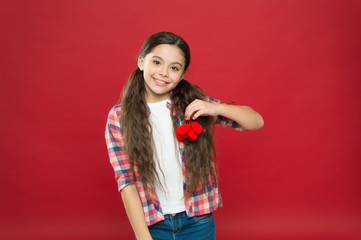 February holiday. Enjoying happy moment. Childrens day. Love and family. Childhood happiness. Happy child with red decorative heart. happy little girl. Valentines day. Small girl with cute look