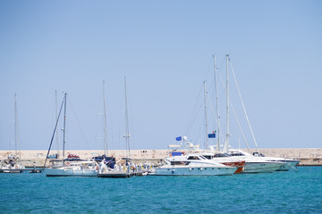Obraz premium BARI, ITALY - JULY 11,2018, Fyachts and boats in the port of Bari, sunny summer day, Apulia