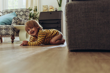Kid playing hide and seek at home