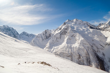 Smooth ski slopes of the Caucasus Mountains on a sunny winter day